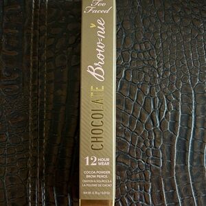 Too Faced Brow-nie 12-Hour Wear Brow Pencil in shade Taupe.
